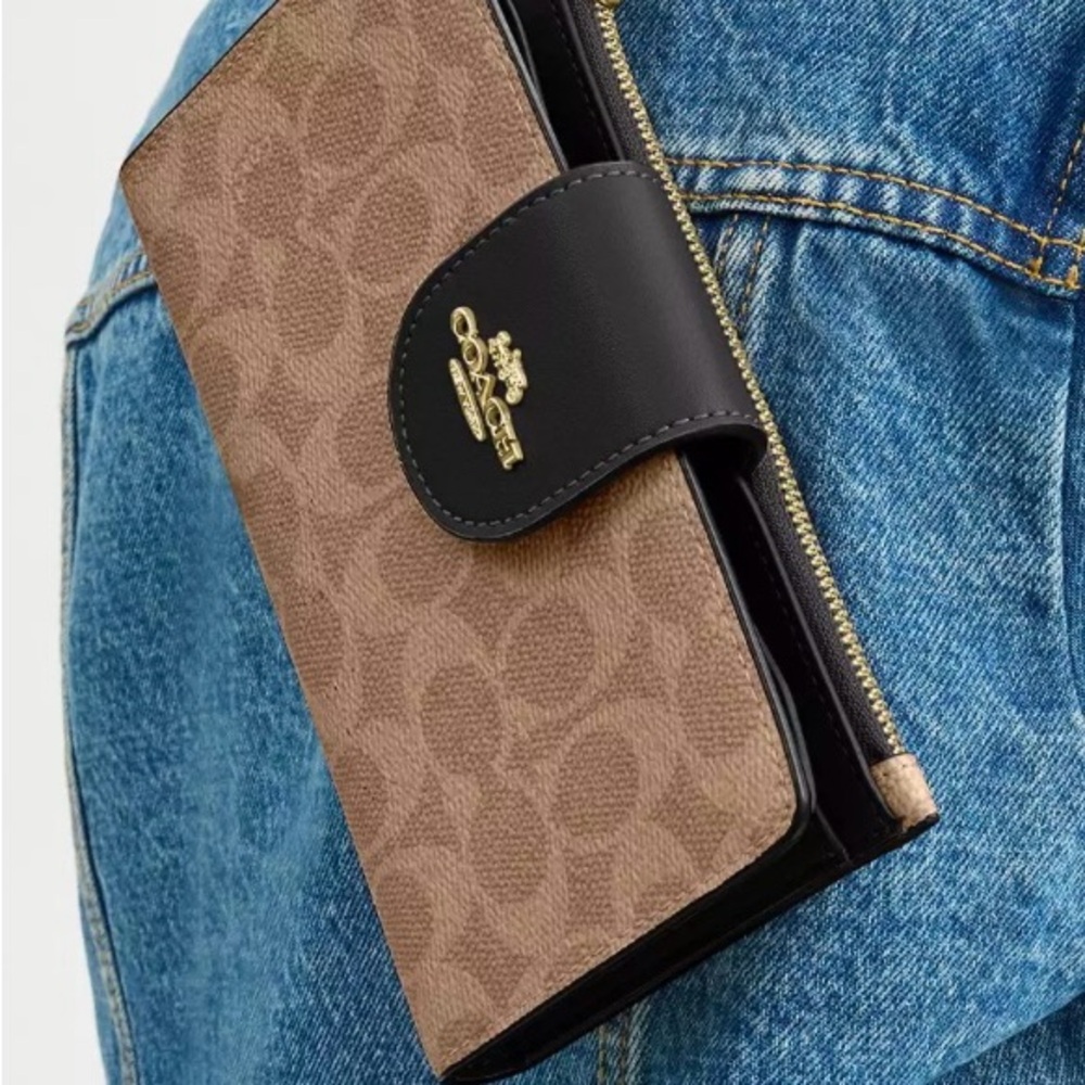 COACH Wallet signature canvas with cellphone holder.